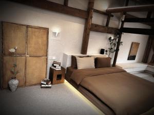 Resort in the valley of Zen 無名川禅意概念酒店客房内的一张或多张床位