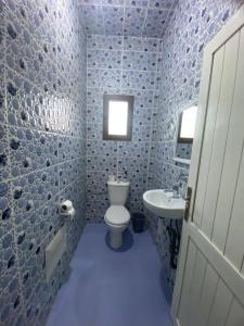 a bathroom with a toilet and a sink at Appartement of Habiba in Essaouira