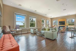 a large living room with furniture and windows at Vanity 2 Bedroom Loft Downtown Ft Worth in Fort Worth