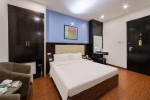Postel nebo postele na pokoji v ubytování A25 Hotel - 15 Hàng Than + 10 fotografií