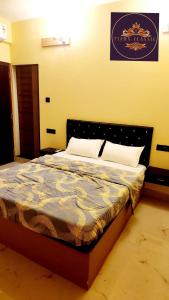 Ένα ή περισσότερα κρεβάτια σε δωμάτιο στο Tiara Classic Calangute Goa +12 φωτογραφίες