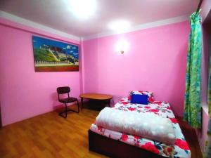 Letto o letti in una camera di Peace Homestay