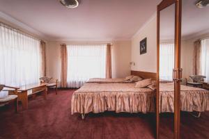 Postel nebo postele na pokoji v ubytování Hotel Twins