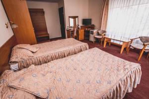 Postel nebo postele na pokoji v ubytování Hotel Twins