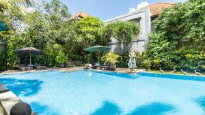 La alberca dentro o cerca de Gita Maha Ubud Hotel by Mahaputra-CHSE Certified