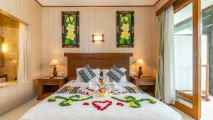 Una cama o camas en una habitación de Gita Maha Ubud Hotel by Mahaputra-CHSE Certified