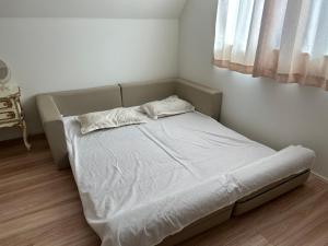 Postel nebo postele na pokoji v ubytování ディアヘッド西一之江