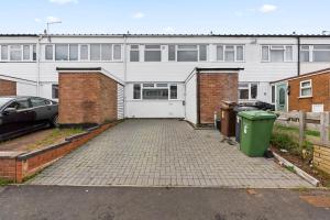 an empty parking lot in front of a building at Large spacious and spotless house with hot tub and snooker and table tennis NEC,JLR,Airport Sleeps 8 in Water Orton