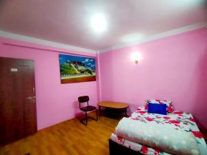 Letto o letti in una camera di Peace Homestay