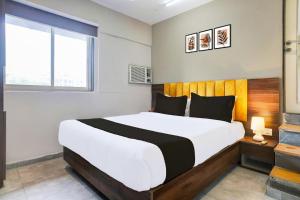 Postel nebo postele na pokoji v ubytování Vibes Inn Juhu
