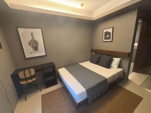 a bedroom with a bed in a room at Lakwa Motel Lio Beach in El Nido
