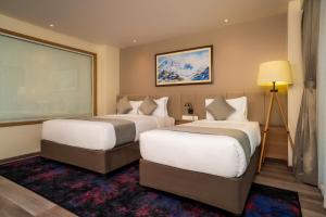 Postel nebo postele na pokoji v ubytování Best Western Plus Kathmandu