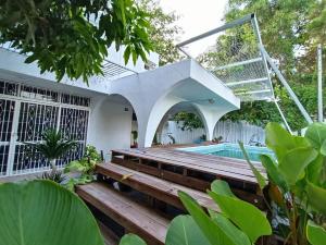 a house with a swimming pool and a staircase at Sohostay in Kuala Terengganu