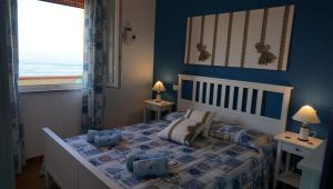 Ένα ή περισσότερα κρεβάτια σε δωμάτιο στο Stella Marina