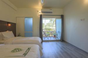 Voodi või voodid majutusasutuse Dhoadhi Beach Maldives toas