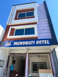 a man standing in front of a jasonmont hotel at Yashomati Hotel in Maheshwar