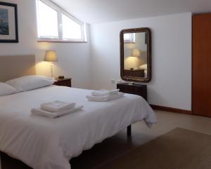 Uma cama ou camas num quarto em Casa do O - Alojamento Local