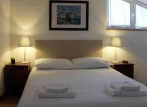 Uma cama ou camas num quarto em Casa do O - Alojamento Local