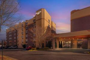 a hotel building with a parking lot in front of it at Comfort Inn University Center in Fairfax