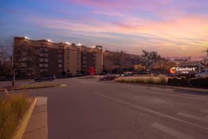 an empty street in a city with a building at Comfort Inn University Center in Fairfax