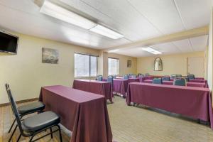 a conference room with purple tables and chairs at Comfort Inn University Center in Fairfax