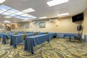 a conference room with blue tables and chairs at Comfort Inn University Center in Fairfax