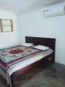 Ένα ή περισσότερα κρεβάτια σε δωμάτιο στο Mermaids Villas