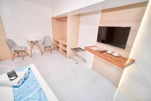Televiisor ja/või meelelahutuskeskus majutusasutuses Circuit Hostel