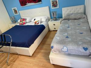 Letto o letti in una camera di Medea rooms palermo centro