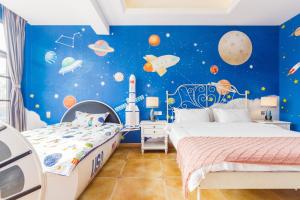Postel nebo postele na pokoji v ubytování Hanju Guesthouse - Near Disney Park