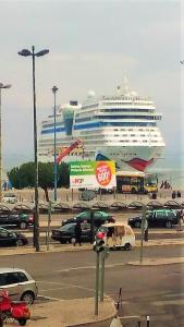 a cruise ship is parked in a parking lot at Alfama Santa Apolonia Apartment in Lisbon