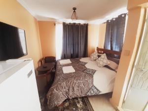 Voodi või voodid majutusasutuse Sparkle Residency toas