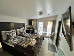 a bedroom with a large couch in a room at Guest house - Northern tealight in Rovaniemi