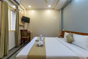 Hotel Chalet, Madiwala客房内的一张或多张床位