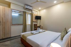 Hotel Chalet, Madiwala客房内的一张或多张床位
