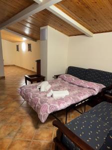 Postel nebo postele na pokoji v ubytování Peri Peri Etna Guest House