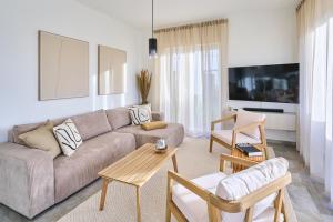 a living room with a couch and a table at Bernstein Apartments in Pouch