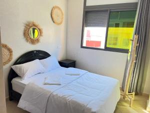Letto o letti in una camera di Sun Set Surf House Imsouane