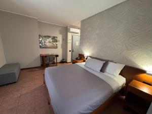 Postel nebo postele na pokoji v ubytování Villa Nasti Hotel Ristorante