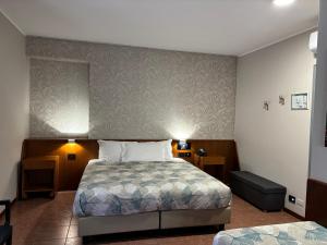 Postel nebo postele na pokoji v ubytování Villa Nasti Hotel Ristorante