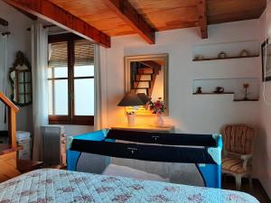 a bedroom with a bed and a desk with a mirror at La Venta Casa Rural in Benitachell +59 photos