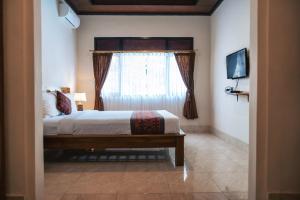 Postel nebo postele na pokoji v ubytování Balimas Guest House + 37 fotografií