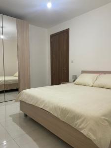Postel nebo postele na pokoji v ubytování Xlendi Apartments