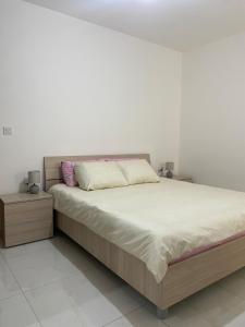 Postel nebo postele na pokoji v ubytování Xlendi Apartments