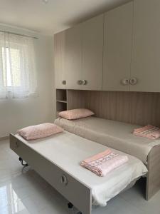 Postel nebo postele na pokoji v ubytování Xlendi Apartments