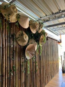 a bunch of umbrellas hanging from a wall at Star house old town lanta in Ko Lanta