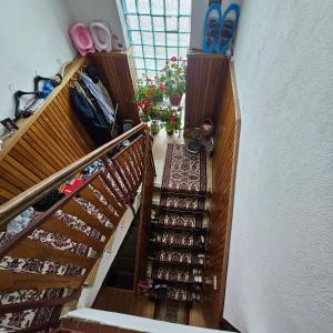 an overhead view of a staircase with shoes and shoes at Izba v dome manželská dvojposteľ in Svidník