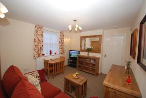 Μια τηλεόραση ή/και κέντρο ψυχαγωγίας στο Saltburn Holidays Bluebell Cottage