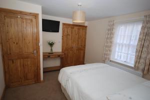 Ένα ή περισσότερα κρεβάτια σε δωμάτιο στο Saltburn Holidays Bluebell Cottage +13 φωτογραφίες