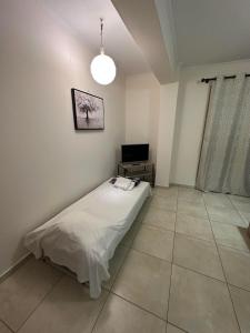 Posteľ alebo postele v izbe v ubytovaní Green House Messini